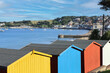 Swanage sea front and colourful beach huts on a sunny summer’s day