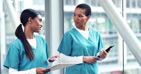 Wall Mural - Woman, doctor and team walking with x ray scan in discussion for surgery, diagnosis or results at hospital. Women, healthcare or medical professionals talking about patient CT or MRI at the clinic