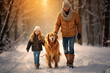 Happy family walking their Golden Retriever in the outdoors in wintertime.