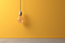 A Light Bulb Hanging Above A Wall