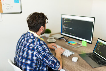 rear view of a programmer developing new software