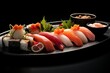 Sushi Set nigiri, rolls, gunkan and sashimi served in the plate