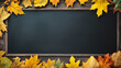 background frame school chalkboard black framed with yellow autumn leaves.
