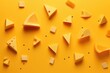 Pattern of assortment cheeses on yellow background. Different kinds of delicious cheese. Parmesan, diced, grated and soft cheese