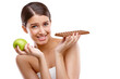 © Mayur/peopleimages.com - Isolated woman, chocolate and apple in portrait with confused face for choice by transparent png background. Girl, model and decision for nutrition, candy and fruits for wellness, diet and health