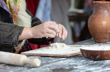 Sticker - A woman kneads the dough with her hands