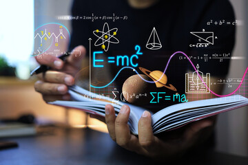 Wall Mural - physics and mathematics equation concept with student writing on a notebook about albert einstein's 