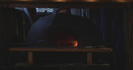 Wall Mural - Wooden pizza oven in a pizzeria