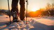 Close-up of shoes of a hiker walking in the snow with hiking sticks during cold winter morning in middle of beautiful nature