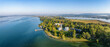Luftbild von der Halbinsel Mettnau im westlichen Bodensee von der Morgensonne angestrahlt mit dem Kurzentrum, Mettnaukur, Schiffanlegestelle und Restaurant Strandcafe