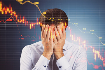 Canvas Print - Anxious businessman covering face because of downward red candlestick forex chart with grid and index on blurry background. Crisis, falling stock market and recession concept.