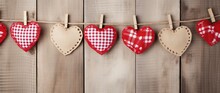 Valentine's Day Background With Hearts And Clothespins On Wooden Wall