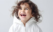 © lutsenko_k_ - Portrait of a laughing child in white clothes on a white background