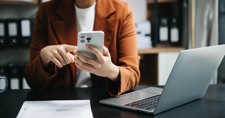 businesswoman hand using laptop, tablet and smartphone in office. digital marketing media mobile app