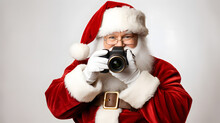 Photographer Santa Claus With The Camera, Christmas Evening And White Background, Fun-loving