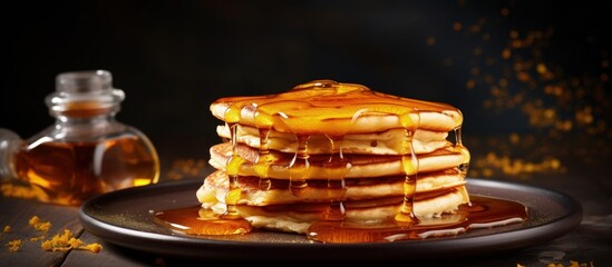 Wall Mural - Fresh pancakes with maple syrup and honey texture copy space image