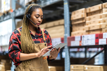 Wall Mural - Portrait african american engineer woman shipping order detail export and import,goods,factory,warehouse,international trade,transportation,cargo ship,logistic,distribution.business industry.