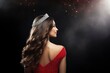 Beauty queen on the stage of a beauty pageant wearing a crown. Beauty queen wearing a tiara photo seen from behind