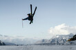 © ADDICTIVE STOCK - Anonymous carefree man skiing and jumping on snowy mountain while enjoying winter day at Swiss Alps