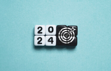 Wall Mural - 2024 year with dartboard arrow on white cube for setup business objective target and investment goal