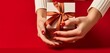Close-up shot of a beautifully wrapped gift box against a red and white background, complemented by modern manicure and pedicure essentials.