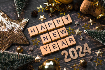 Canvas Print - A postcard or banner. A symbol from the number 2024 with golden balls, stars, sequins and a beautiful bokeh on a wooden background. Happy New Year 2024. The concept of the celebration.