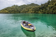 Empty Inflatable Rubber Dinghy In Ocean, Raja Ampat, West Papua, Indonesia
