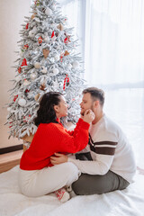 Sticker - beautiful couple near christmas tree