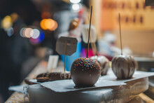 Chocolate Apple Covered Sprinkled With Glaze At The Christmas Market