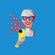 © Марина Демешко - Antique smiling statue head in colorful sunglasses holding yellow mobile phone with like symbols from social media on blue color background. Creative collage. Contemporary art. Modern design