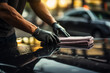 A man cleaning black car with microfiber cloth, car detailing (or valeting) concept. Selective focus. Generative Ai