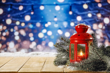 Wall Mural - Red lamp on table and winter landscape. 