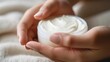 The Essence of Self-Care: Gentle Hands with a Pot of Hydrating Lotion