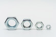 iron nut on a white background. metal nut on a light background. photos of nuts and bolts for the catalog