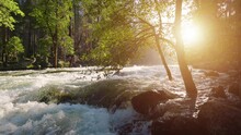 River Rapids In The Merced River As It Runs Through Yosemite National Park In California. Slow Motion.