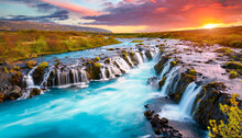 bruarfoss waterfall iceland fantastic south iceland with a colorful sunset an blue water iceland is a most popular place of travel travel is a lifestyle concept