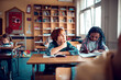 © Marko Geber - Diverse children writing notes in elementary classroom