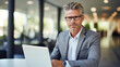 © IRStone - Successful businessman portrait in office. Confident, attractive, professional person with office interior blur at the background