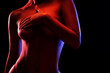 © Dimid - Slim sexy woman in lingerie on a dark background. Her body is illuminated with blue and red lights.
