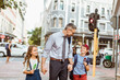 © Geber86 - Happy father walking kids to school after work