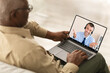Senior Black Man Using Laptop, Have Video Call With Consultant