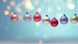  a group of christmas ornaments hanging from a string on a blue background with a boke of lights in the background.