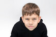 © Мар'ян Філь - The young boy froze and hunched over. A young boy with sad inquisitive look seems to be asking why so, for what? The boy has problems with communication with his peers