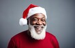 © Jorge Ferreiro - african ethnic man dressed as santa claus with a joyful smile