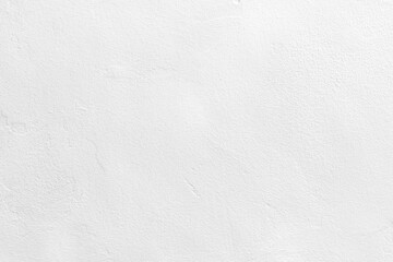 White concrete wall texture background. Uneven render stucco white painted concrete wall texture background. Rough and grunge wall in the sun. 