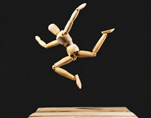 Wooden Mannequin Figures Jumping, A Person Doing Kick, White Background