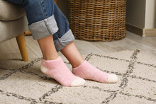 Woman In Warm Pink Socks At Home