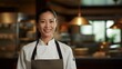 Portrait of smiling female chef standing in the kitchen