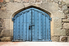 Old Blue Door Or Gate In Stone Wall, Locked