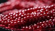 Juicy and vibrant, the crimson bead beckons with the promise of tangy sweetness, evoking images of ripe berries and the irresistible allure of nature's bounty